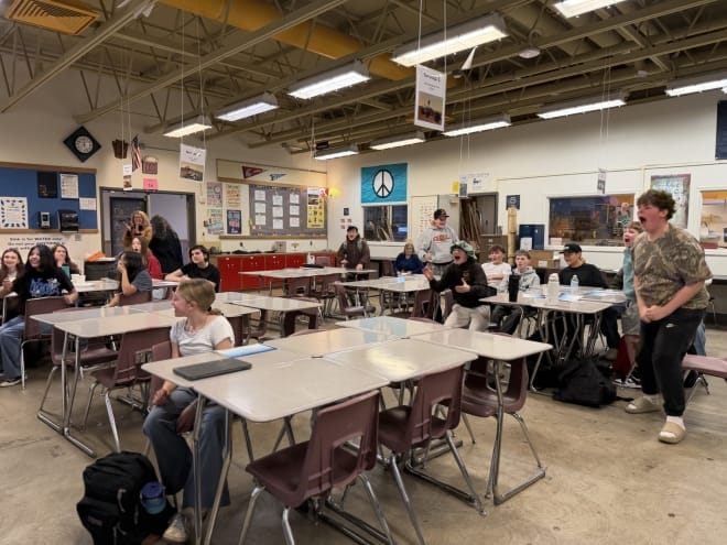 Image shows students celebrating during announcement of their win